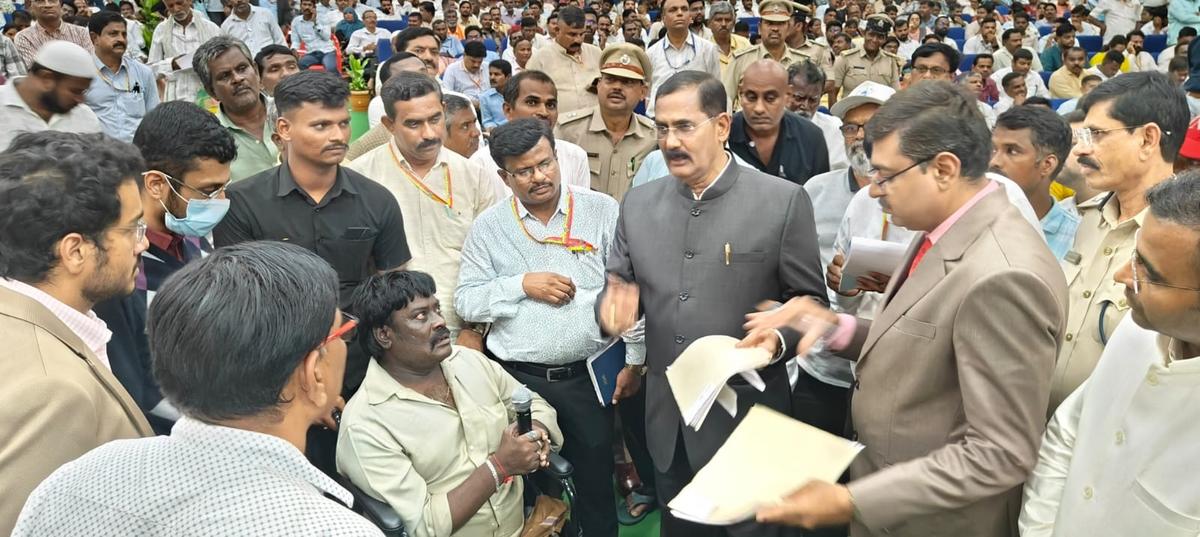 Upa Lokayukta Justice B. Veerappa listening to the grievances of a person with disabilities in Raichur on August 29, 2025. 