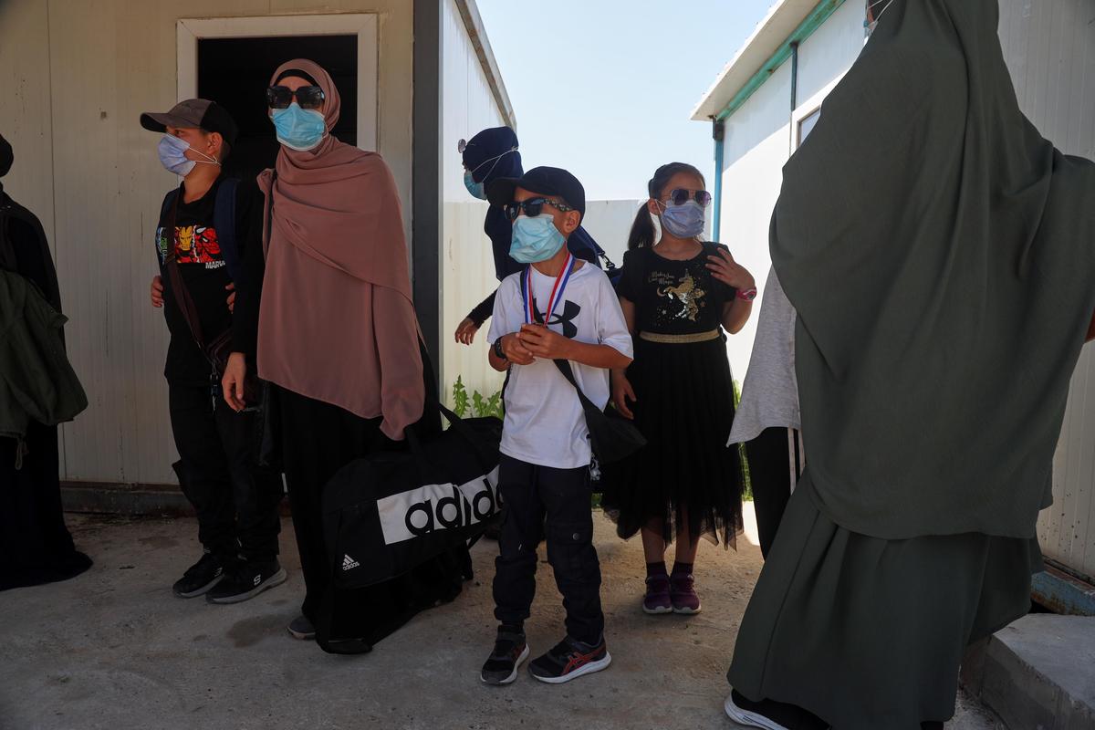 File picture of members of Australian families at Roj Camp in eastern Syria, housing people with alleged ties to Islamic State militants, preparing to leave for Damascus as part of a second repatriation effort by Syrian authorities, at Roj Camp in eastern Syria