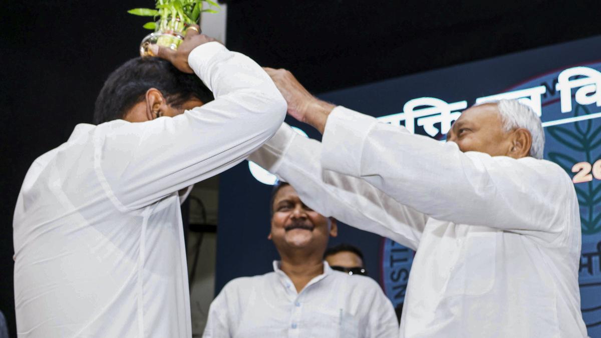 Nitish Kumar courts controversy for placing flower pot IAS officer’s head