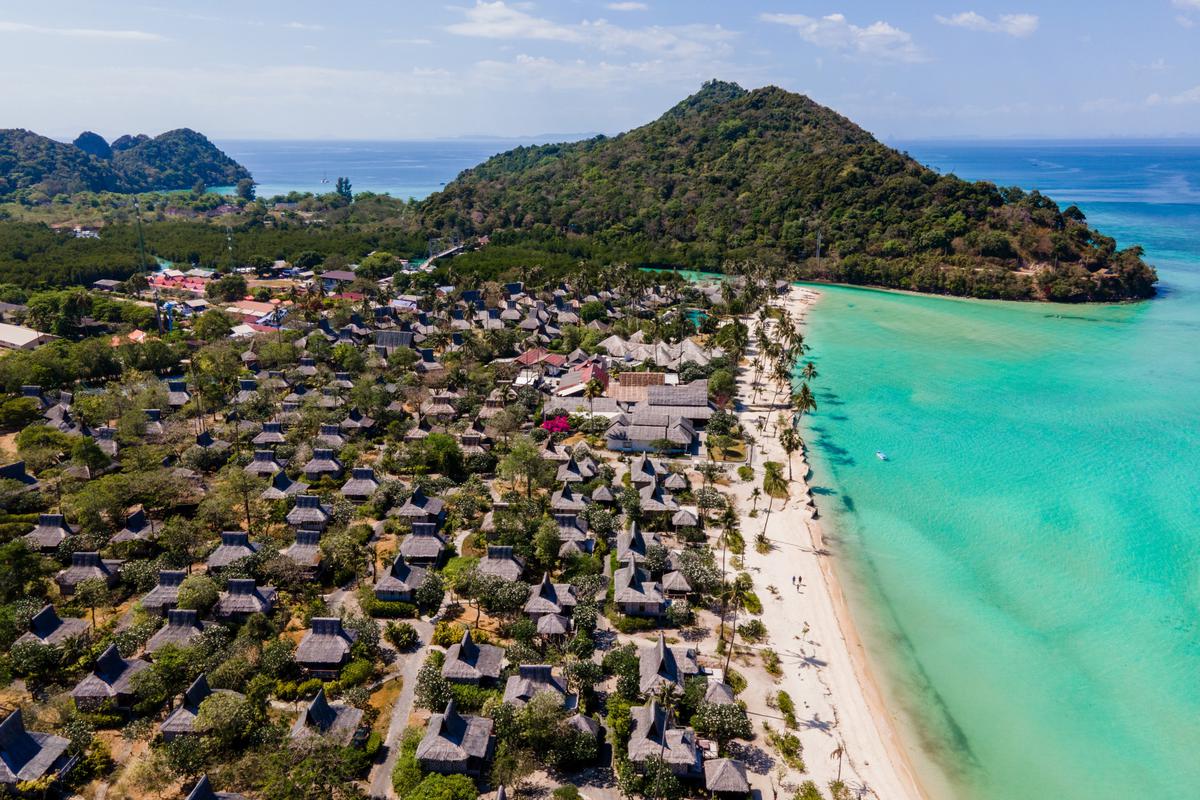 Locally built thatched roof and walled guest bungalows at Psi Phi Phi Island Village resort near Maya Bay.