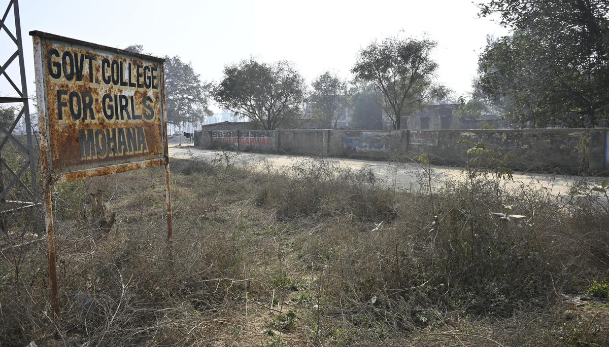 A signboard of Government College for Girls which is running inside the premises of Government Senior Secondary School, Mohana in Sonipat district.