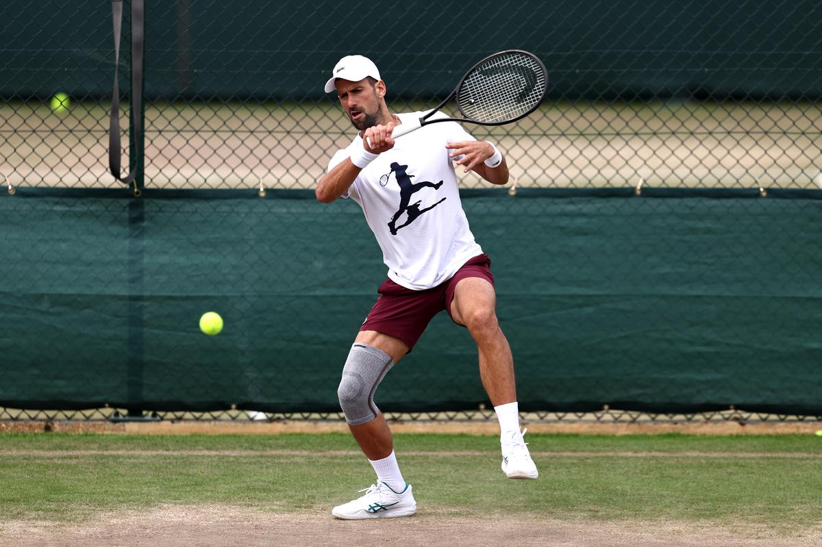 Novak Djokovic of Serbia plays a forehand on the practice court during day thirteen of The Championships Wimbledon 2024.