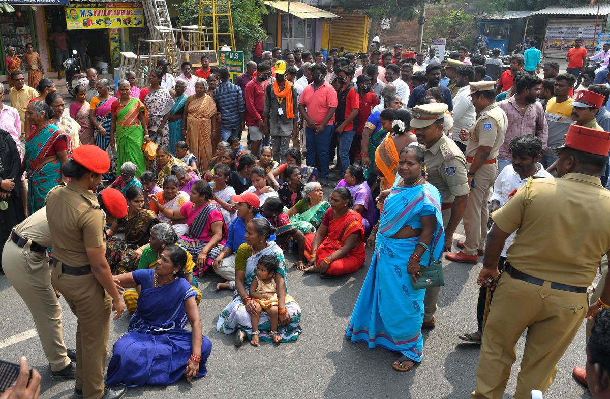 Residents protest against opening of a liquor outlet at Samipillai Thottam, women protesters sit on a dharna