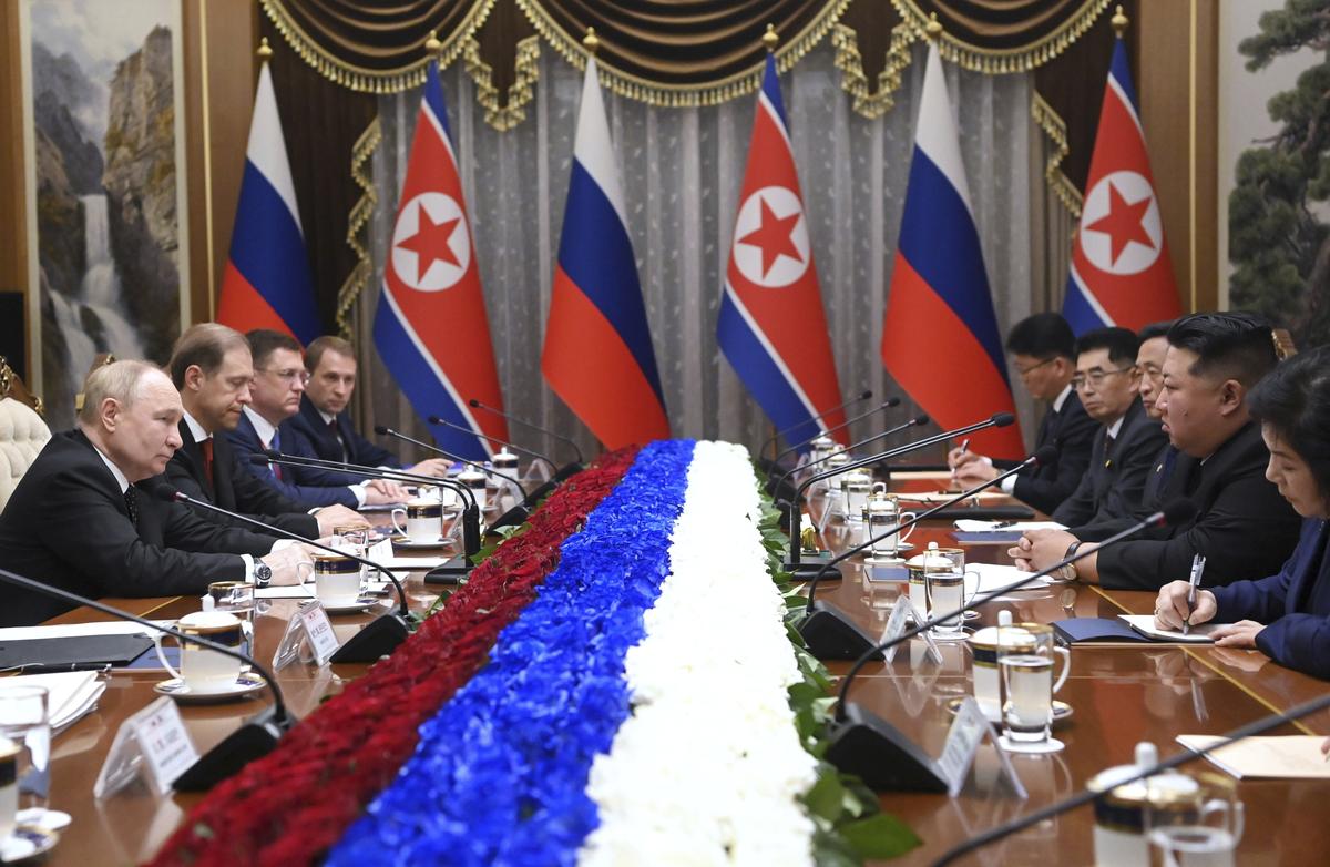 Russian President Vladimir Putin, left, and North Korea’s leader Kim Jong Un, second right, attend the talks in Pyongyang, North Korea on June 19, 2024.