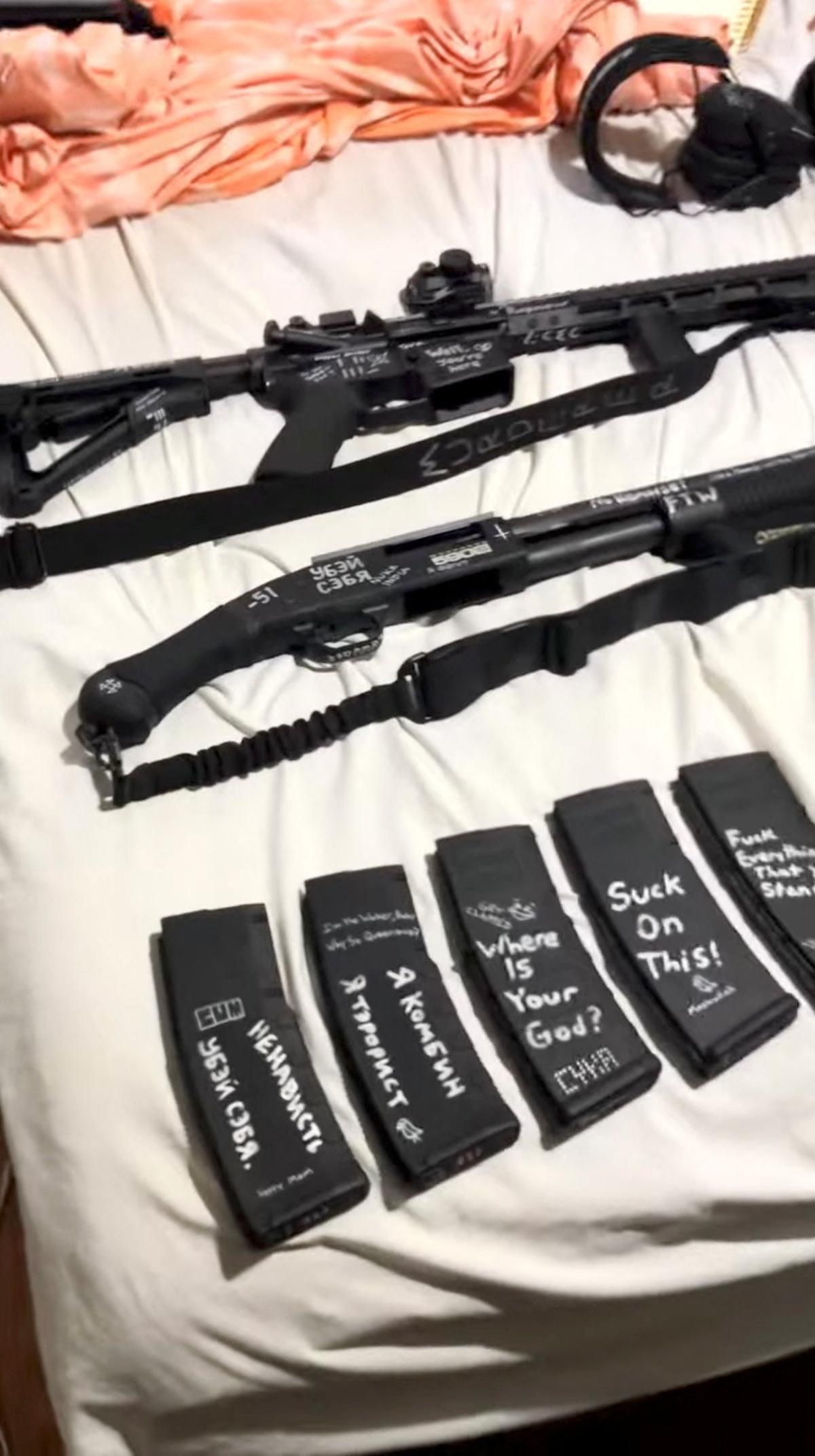 Weapons and rifle magazines, adorned with messages and names, appear in a still image from an undated video that was previously posted to social media and filmed by Robin Westman, identified by a law enforcement source as the suspected shooter in the Annunciation Church attack in Minneapolis. The video has since been removed. 