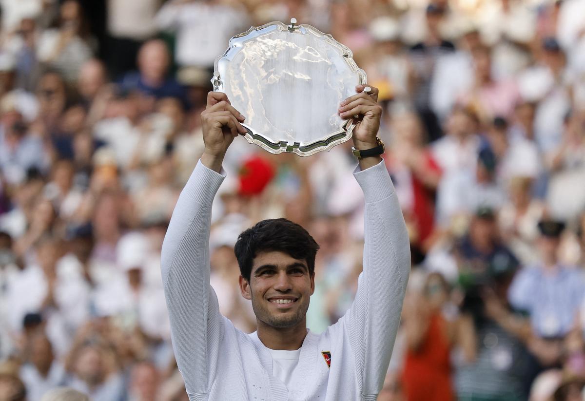 Runner up Spain’s Carlos Alcaraz with a trophy after losing the men’s singles final against Italy’s Jannik Sinner.