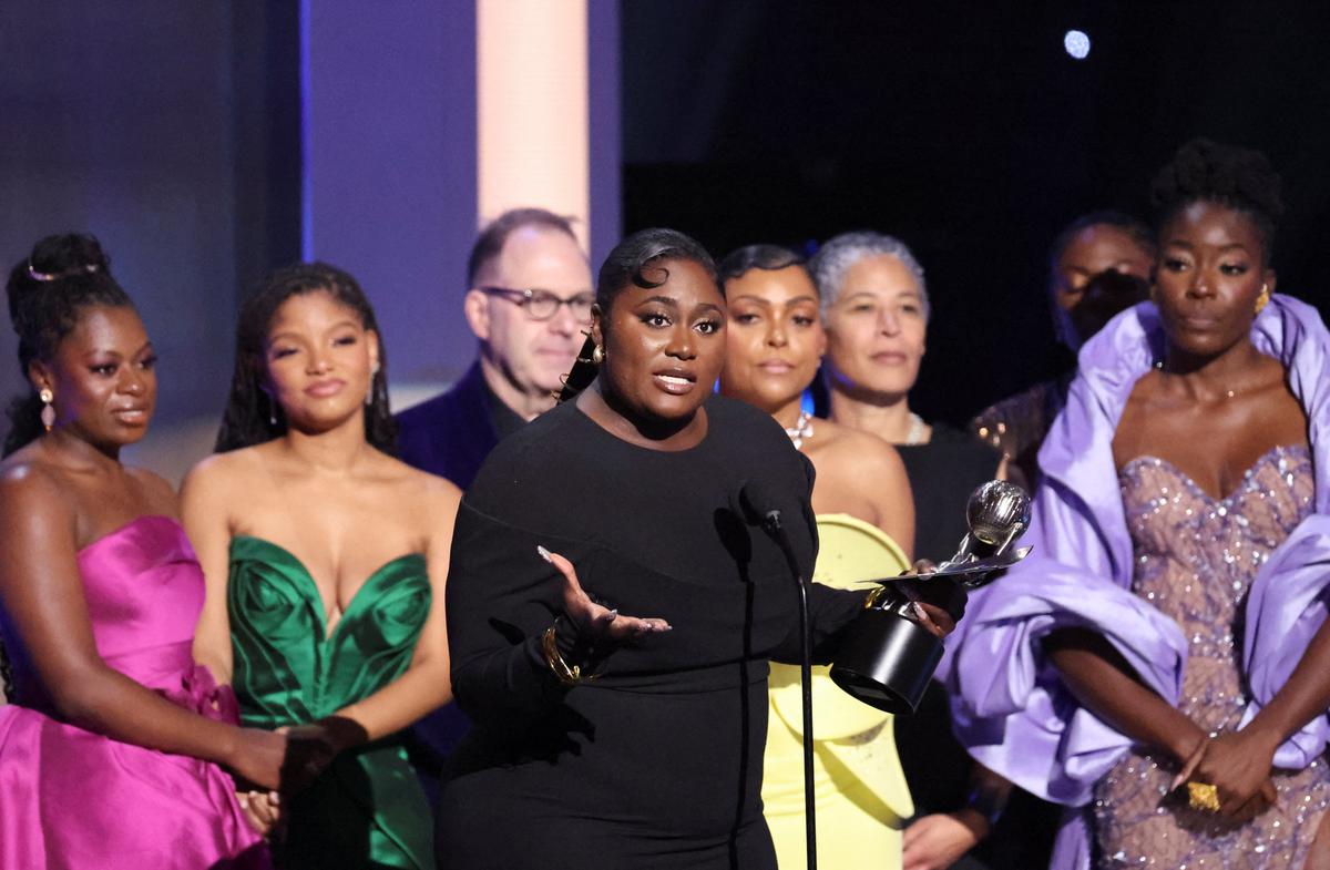 Danielle Brooks speaks as the cast members react while accepting the Outstanding Motion Picture award for “The Color Purple” at the 55th NAACP Image Awards at Shrine Auditorium in Los Angeles, California, U.S., March 16, 2024.