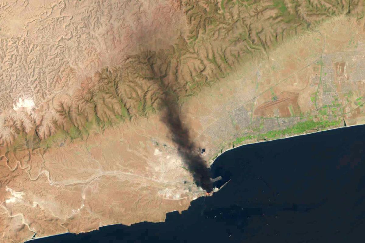 This satellite image taken by a U.S. Geological Survey Landsat satellite shows a fire days after a suspected Iranian attack targeting the port in Salalah, Oman, on Monday, March 16, 2026. This satellite image taken by a U.S. Geological Survey Landsat satellite shows a fire days after a suspected Iranian attack targeting the port in Salalah, Oman, on Monday, March 16, 2026.