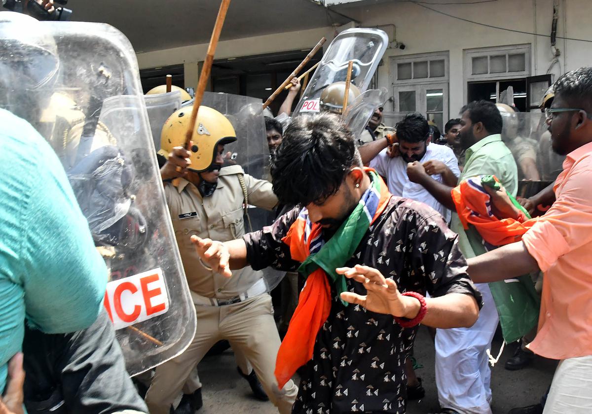 Police personnel use force to disperse Yuva Morcha activists who tried to enter the Corporation office demanding the resignation of Mayor Arya Rajendran in Thiruvananthapuram on Thursday.