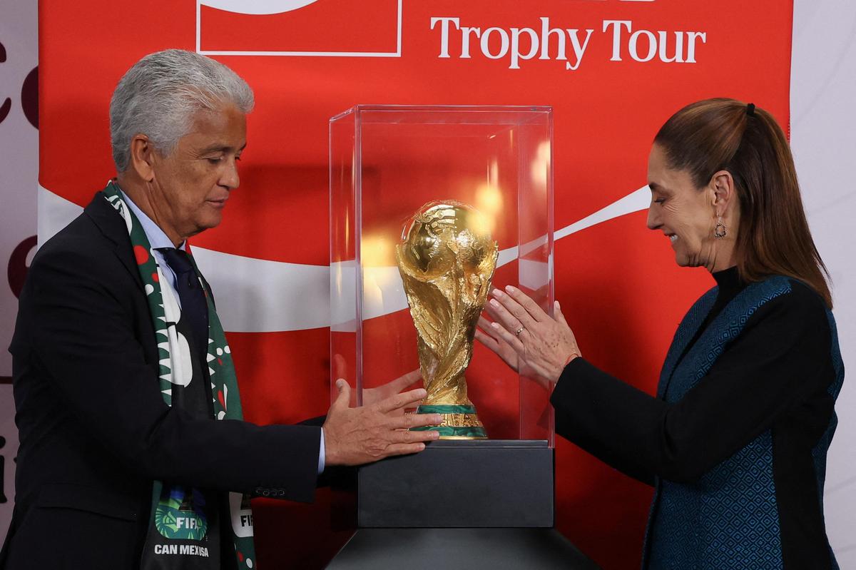 Brazilian former player Jose Roberto Gama de Oliveira 'Bebeto' and Mexico's President Claudia Sheinbaum with the FIFA World Cup trophy in Mexico City