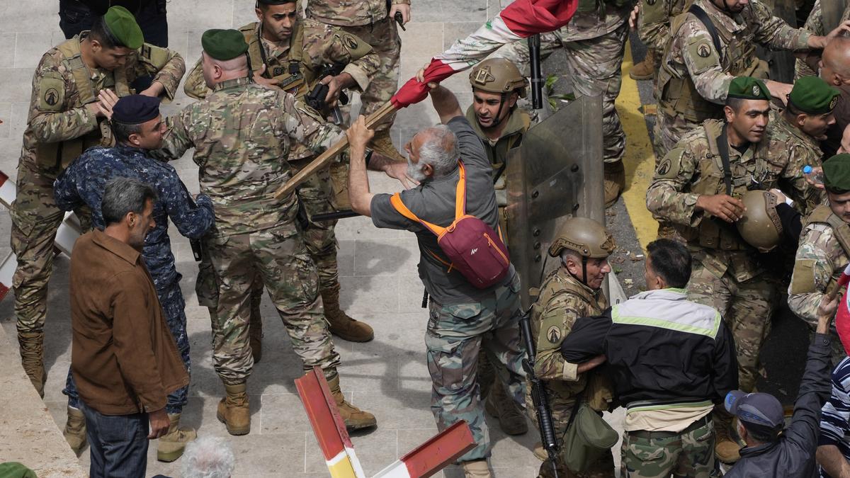 Lebanese security forces fire tear gas as protesters try to storm government headquarters in Beirut