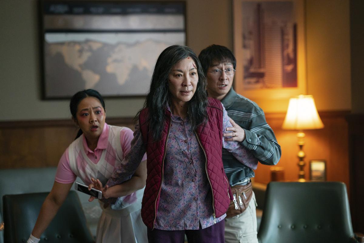 This image released by A24 Films shows, from left, Stephanie Hsu, Michelle Yeoh and Ke Huy Quan in a scene from, “Everything Everywhere All At Once.”