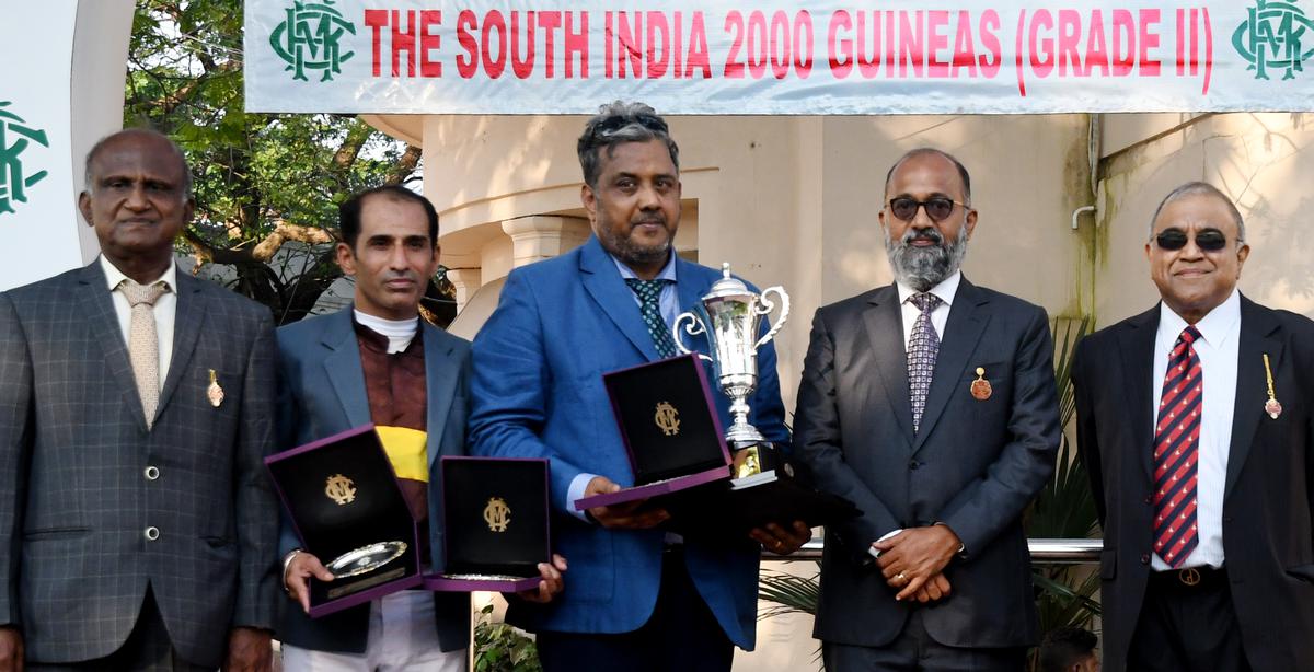 Jockey P.S. Chouhan, second from left, and Forseti’s trainer Prasanna Kumar, centre, after receiving the South India 2000 Guineas Trophy from M.A.M.R. Muthiah, second from right, as M. Ravi and Ranjit Jesudasen look on.