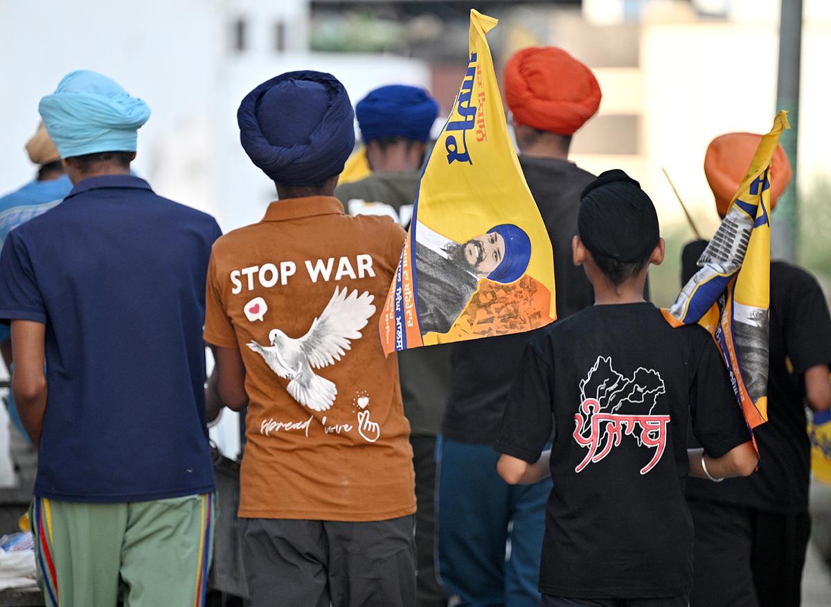 Young supporters of Amritpal Singh roam in streets with his flags and banners for upcoming lok sabha election at his hometown at Jallupur Khera in Punjab. Young supporters of Amritpal Singh roam in streets with his flags and banners for upcoming lok sabha election at his hometown at Jallupur Khera in Punjab.