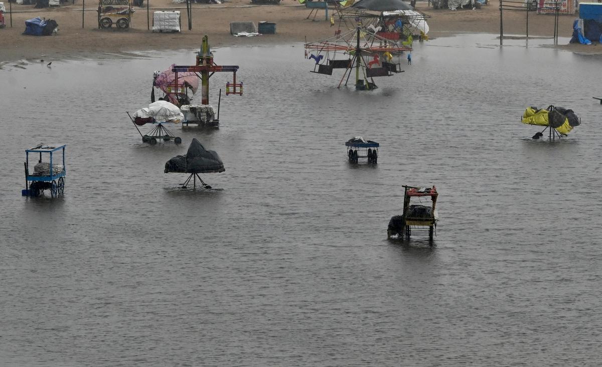 A weakened Cyclone Ditwah lashed the Tamil Nadu coast and caused intense rainfall, leading to widespread waterlogging at Marina Beach. The sea was rough with massive waves hitting the shore, prompting authorities to ban public access for safety. The heavy rains and flooding caused shops near Marina Beach to be surrounded by water, rendering them inaccessible and effectively marooned. 