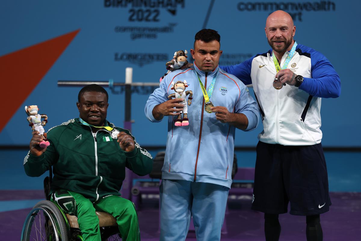(L-R) Silver medalist Ikechukwu Christian Obichukwu of Team Nigeria, Gold medalist Sudhir of Team India and Bronze medalist Micky Yule of Team Scotland celebrate during the Men’s Para Powerlifting Heavyweight medal ceremony on day seven of the Birmingham 2022 Commonwealth Games at NEC Arena on August 4, 2022, in Birmingham, England. 