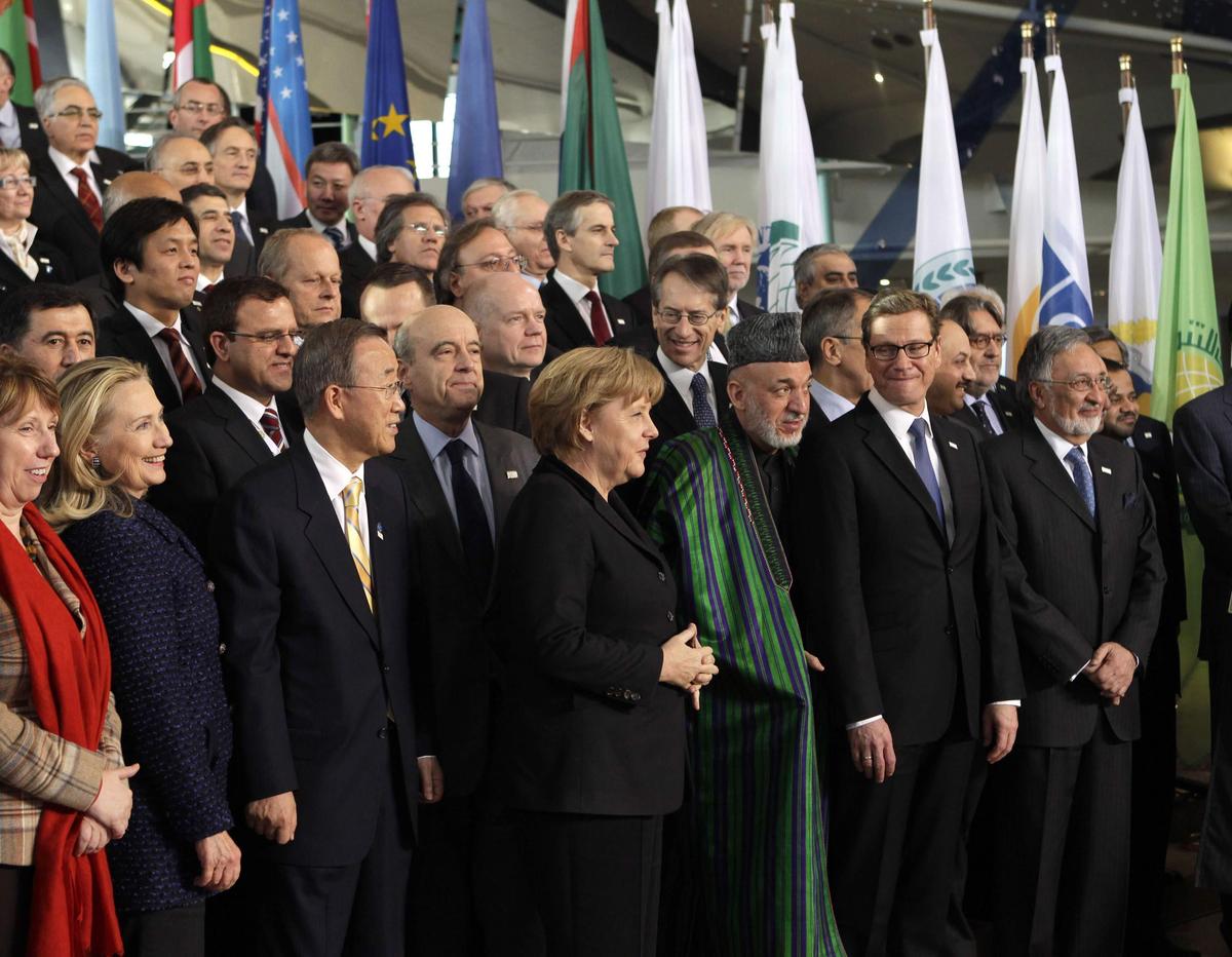 BUILDING ANEW: (Front row L-R) EU foreign policy chief Catherine Ashton, U.S. Secretary of State Hillary Clinton, U.N. Secretary-General Ban Ki-moon, German Chancellor Angela Merkel, Afghan President Hamid Karzai, German Foreign Minister Guido Westerwelle, and Afghan Foreign Minister Zalmay Rassoul join foreign ministers and world leaders for a group photo during an international conference on the future of Afghanistan, in Bonn, December 5, 2011. Iran was among the foreign governments to lend support to the conference.