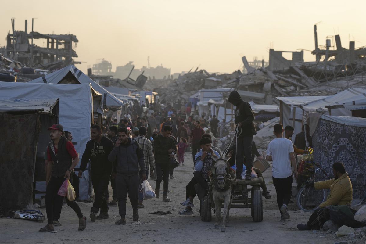 Palestinians walk amid the rubble of destroyed homes and buildings in Jabaliya, northern Gaza Strip on Friday, March 14, 2025. (AP Photo/Jehad Alshrafi) Palestinians walk amid the rubble of destroyed homes and buildings in Jabaliya, northern Gaza Strip on Friday, March 14, 2025. (AP Photo/Jehad Alshrafi)