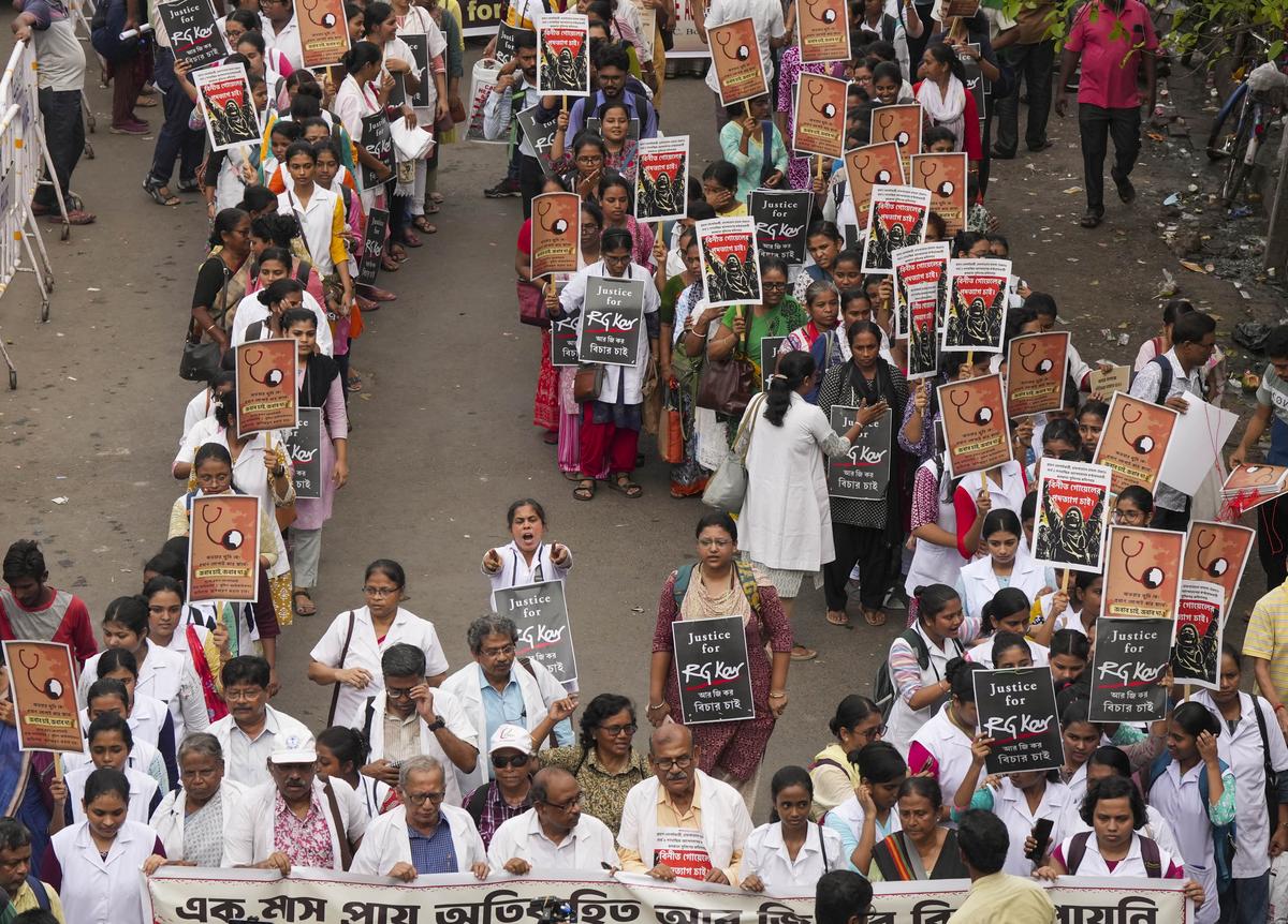 Health workers and others take part in a protest rally against the West Bengal administration over the alleged sexual assault and murder of a trainee doctor, in Kolkata, on September 7, 2024. 