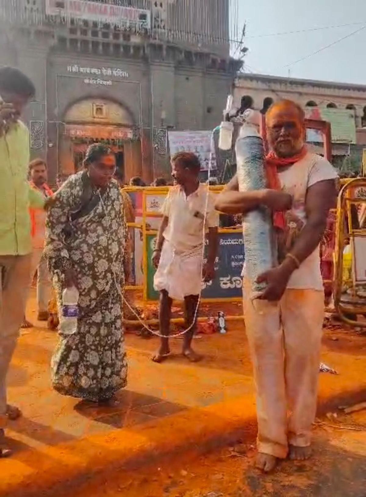 Devotee-couple bring oxygen cylinder for darshan at Mayakka Devi Temple in  Chinchali - The Hindu