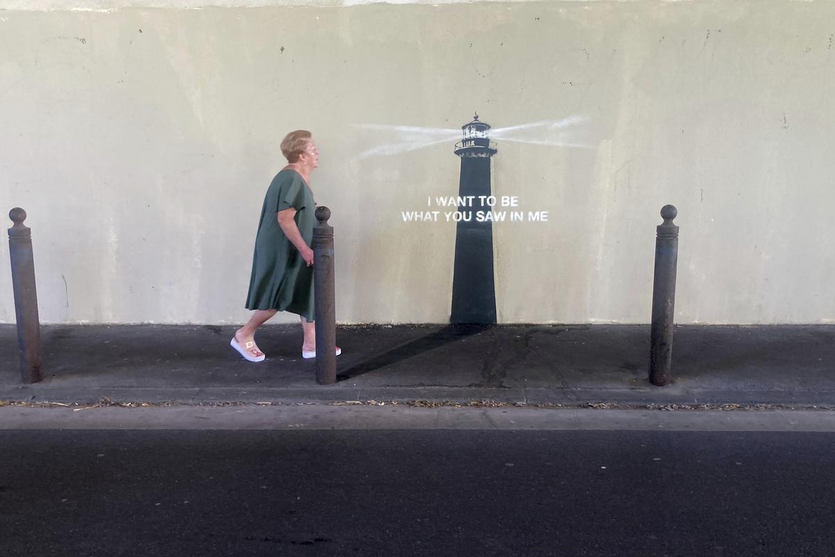 A woman walks past an artwork by street artist Banksy on May 30, 2025 in Marseille, southern France. A woman walks past an artwork by street artist Banksy on May 30, 2025 in Marseille, southern France.