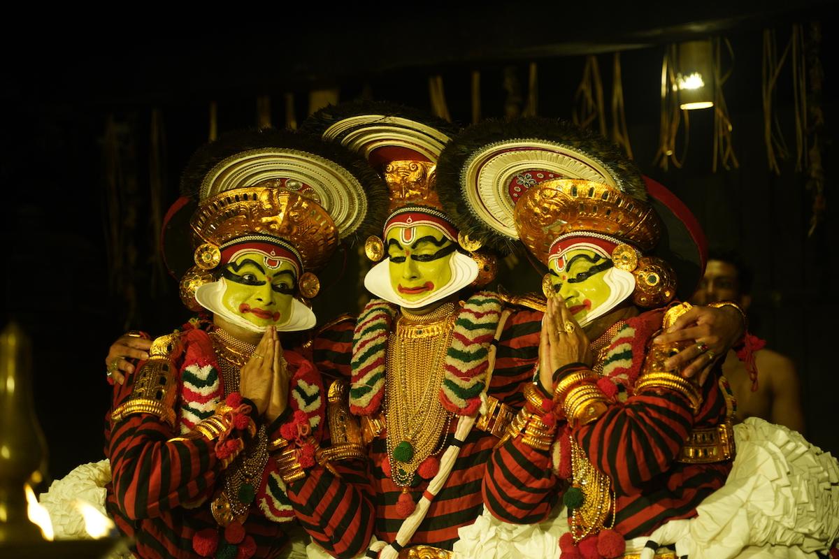 Rama (Rahul Chakyar) flanked by Lakshmana (Nepathya Yadukrishnan) and Margi Madhu (Bharata) in Atavyankam Rama (Rahul Chakyar) flanked by Lakshmana (Nepathya Yadukrishnan) and Margi Madhu (Bharata) in Atavyankam