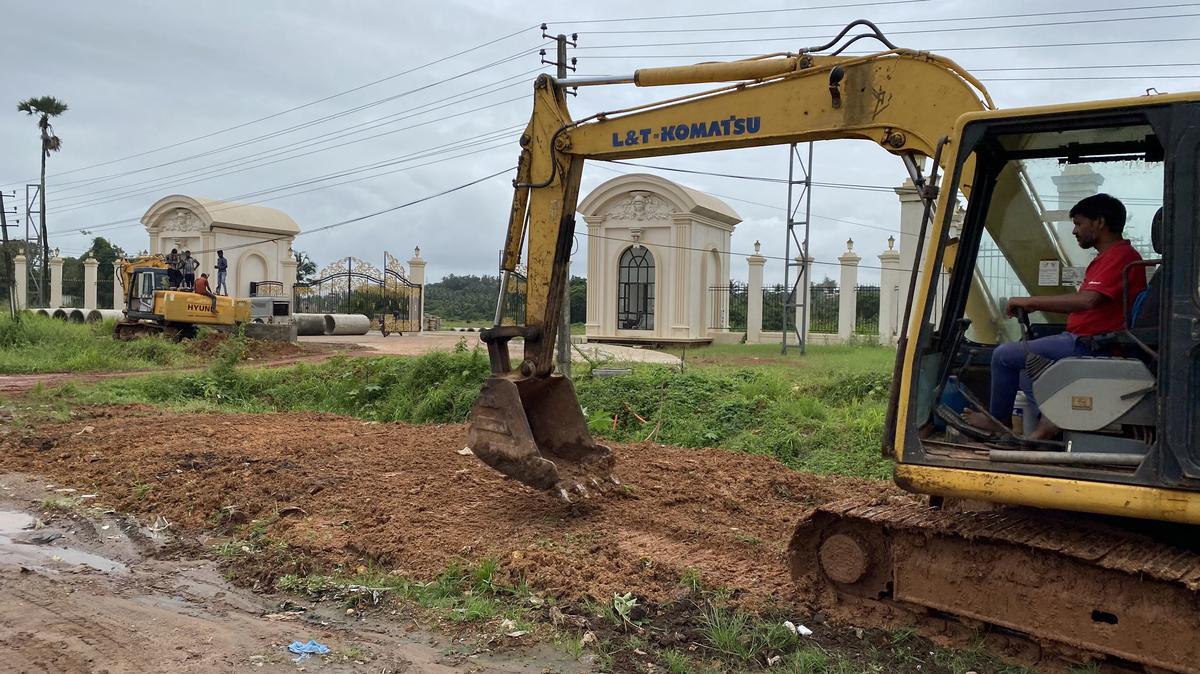 Workers cleaning the roadsides in front of Goldfinch City at Bangra Kulur where Prime Minister Narendra Modi will address a gathering during his visit to Mangaluru on September 2, 2022. Workers cleaning the roadsides in front of Goldfinch City at Bangra Kulur where Prime Minister Narendra Modi will address a gathering during his visit to Mangaluru on September 2, 2022.