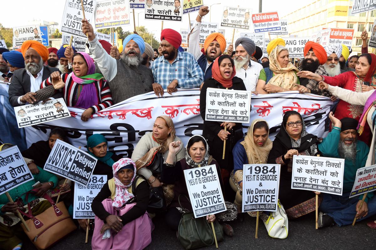 Delhi Sikh Gurudwara Management Committee activists demanding the arrest of political leaders involved in the 1984 riots, in New Delhi. Delhi Sikh Gurudwara Management Committee activists demanding the arrest of political leaders involved in the 1984 riots, in New Delhi.