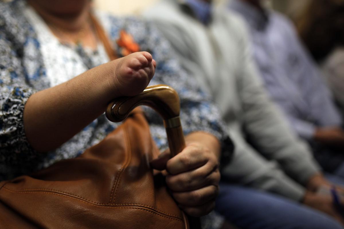 In this file photograph people born with severe defects are seen waiting for the trial against German company Gruenenthal Group to start at the Court in Madrid, Spain, in 2013 