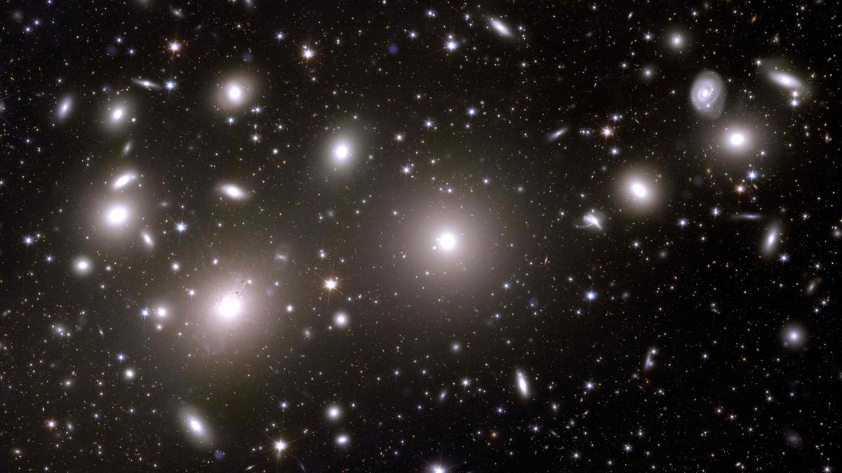 This undated handout obtained on November 2, 2023 from the European Space Agency ESA shows an alternative crop of an astronomical image of galaxies belonging to the Perseus Cluster taken during ESA’s Euclid space mission, which is built and operated by the European Space Agency ESA and with contributions from NASA. 