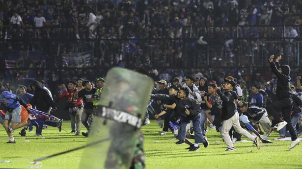 Indonesia police say at least 129 people killed after stampede at football match