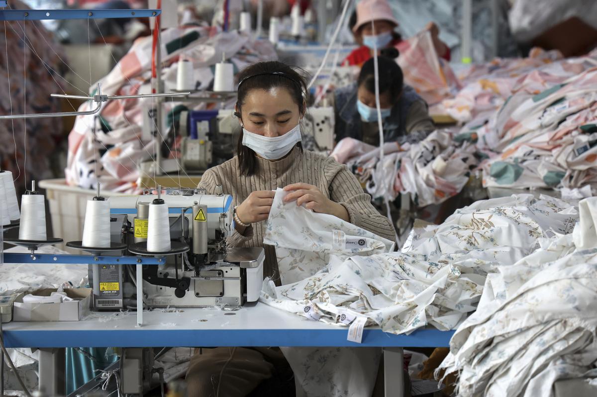 Factory output weakens on widespread slowdown, China curbs