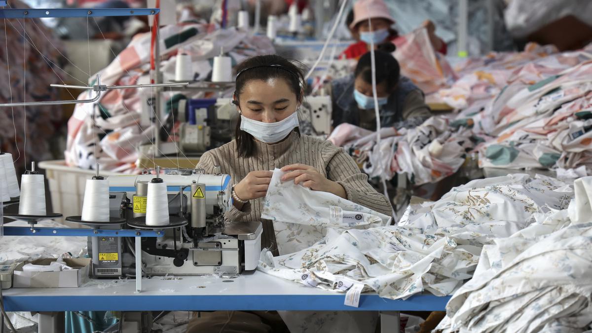 China's economy stabilises, factory activity returns to expansion