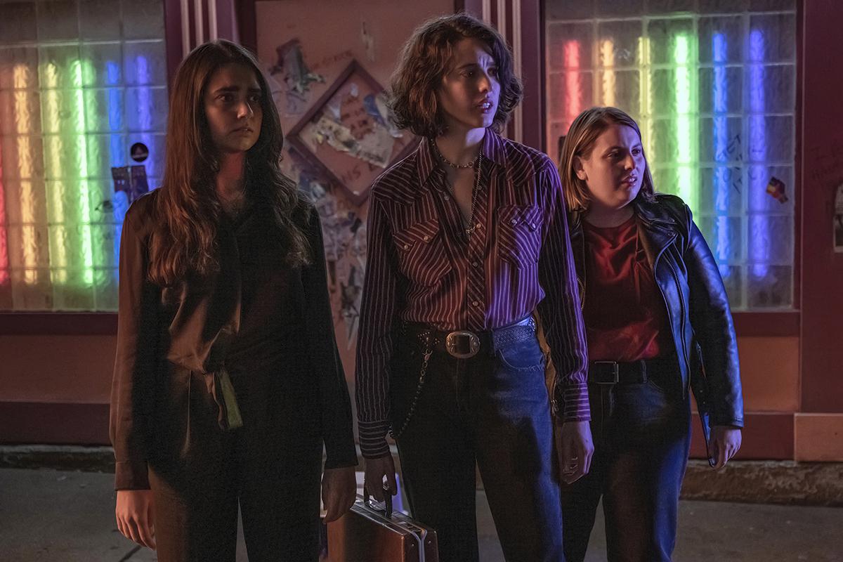 This image released by Focus Features shows Geraldine Viswanathan, left, Margaret Qualley and Beanie Feldstein, right, in a scene from ‘Drive-Away Girls’
