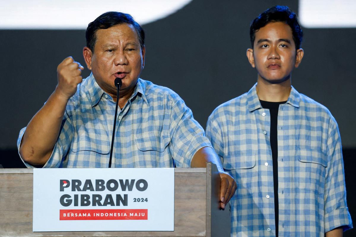 Indonesiaâs Defence Minister and leading Presidential candidate Prabowo Subianto delivers his speech as his running mate Gibran Rakabuming Raka.
