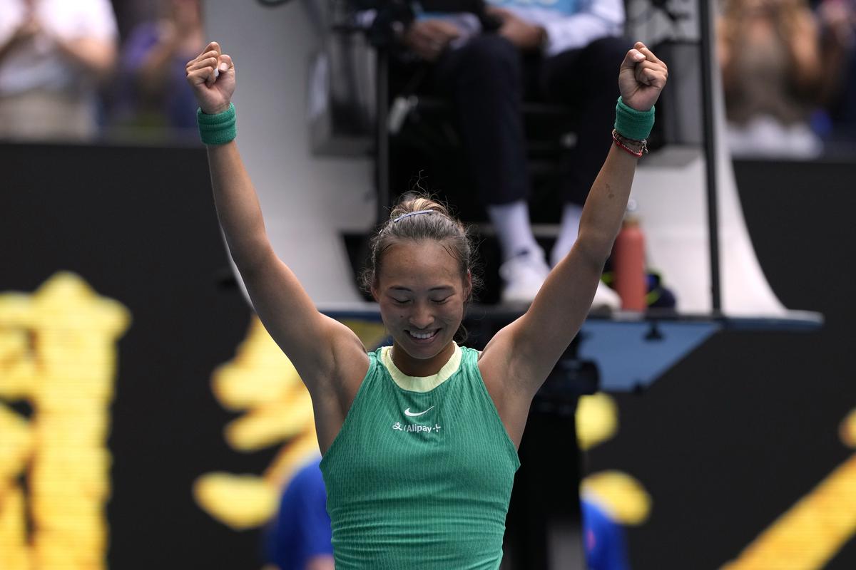 Zheng Qinwen of China celebrates after defeating compatriot Wang Yafan in their third round match at the Australian Open tennis championships at Melbourne Park, Melbourne, Australia, Saturday, Jan. 20, 2024. 