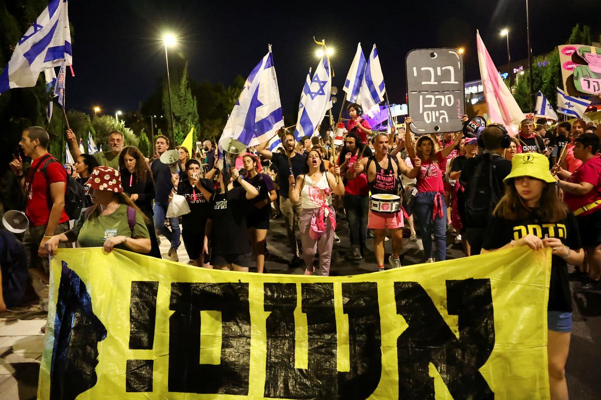 Protesters attend a demonstration against Israeli Prime Minister Benjamin Netanyahu’s government, near the Knesset, the Israeli parliament, in Jerusalem on June 17, 2024. 
