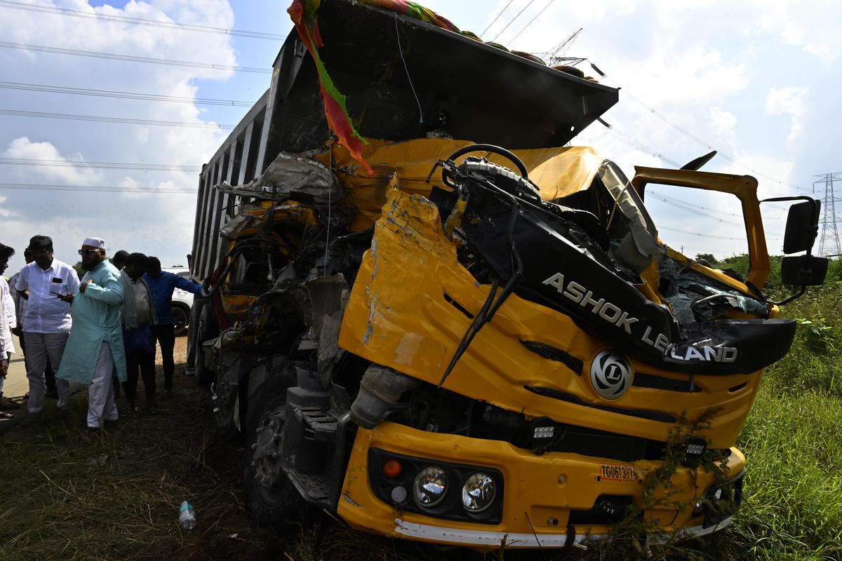 Officials and media gather near the wreckage of a tipper lorry after it collided head-on with a Telangana RTC bus near Chevella, in Ranga Reddy district on November 3. Officials and media gather near the wreckage of a tipper lorry after it collided head-on with a Telangana RTC bus near Chevella, in Ranga Reddy district on November 3.