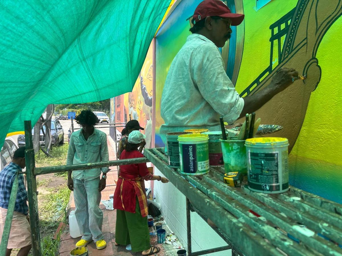 An artist painting the mural   