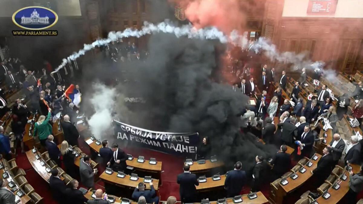 Watch: Smoke bombs and flares thrown in chaotic Parliament session in Serbia