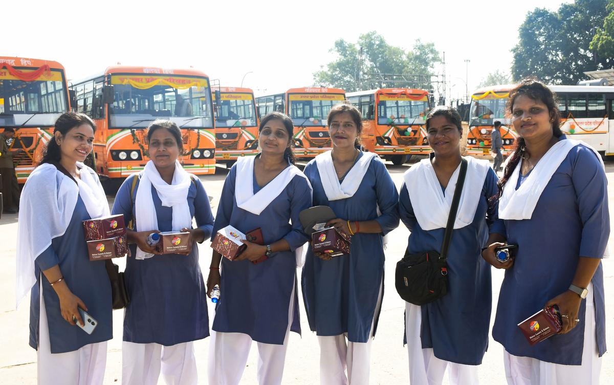Women drivers pose for photos after Uttar Pradesh Chief Minister Yogi Adityanath flagged off new buses, commanded by women drivers, on the occasion of ‘Maha Ashtami’ during the Navratri festival, in Ayodhya, on Oct. 22, 2023. 