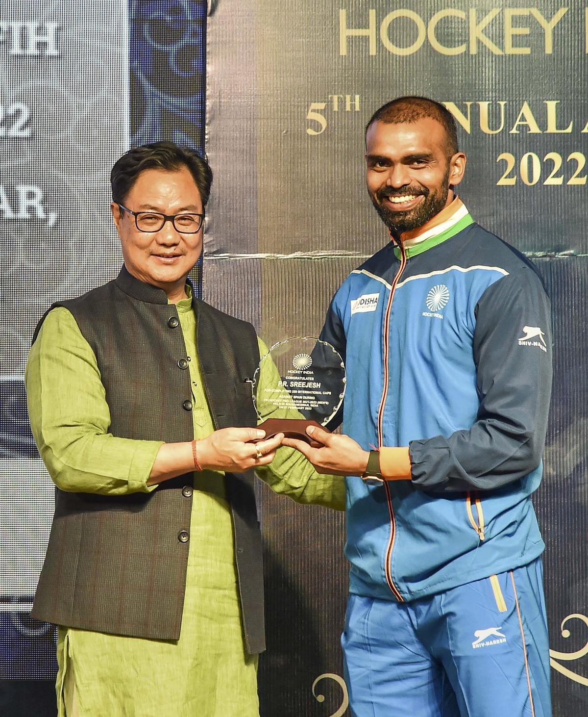 Union Law Minister Kiren Rijiju honours hockey player Sreejesh at Hockey India’s 5th Annual Awards, in New Delhi, on March 17, 2023. 