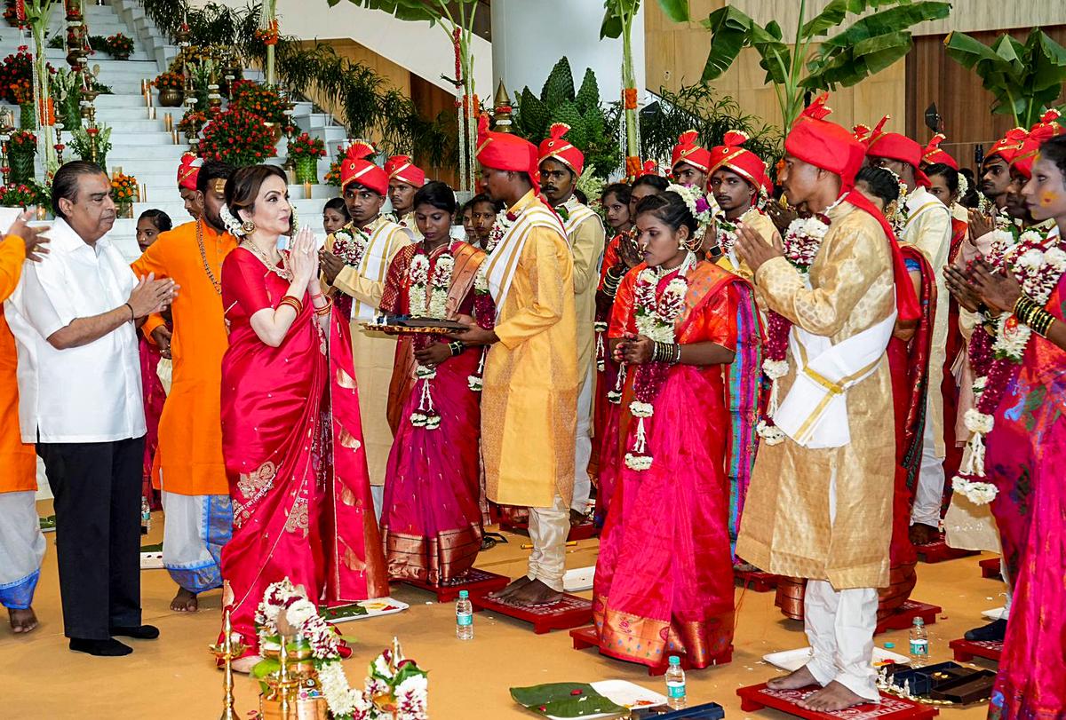 Navi Mumbai, July 02 (ANI): Reliance Industries Chairman Mukesh Ambani and Nita Ambani at the mass wedding of the underprivileged being organised as part of the wedding celebrations of Anant Ambani and Radhika Merchant, in Navi Mumbai on Tuesday. (ANI Photo)