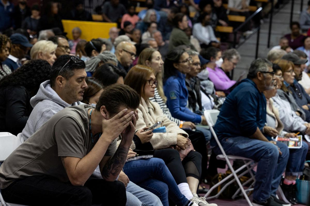 A local resident affected by the Eaton Fire in Altadena reacts at a community meeting in Pasadena, California, U.S. January 12, 2025. 