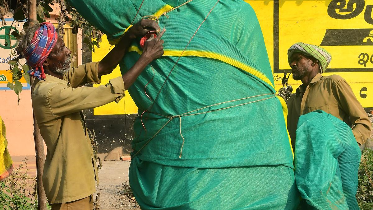 Officials remove flags of various political parties, cover statues as MCC comes into force