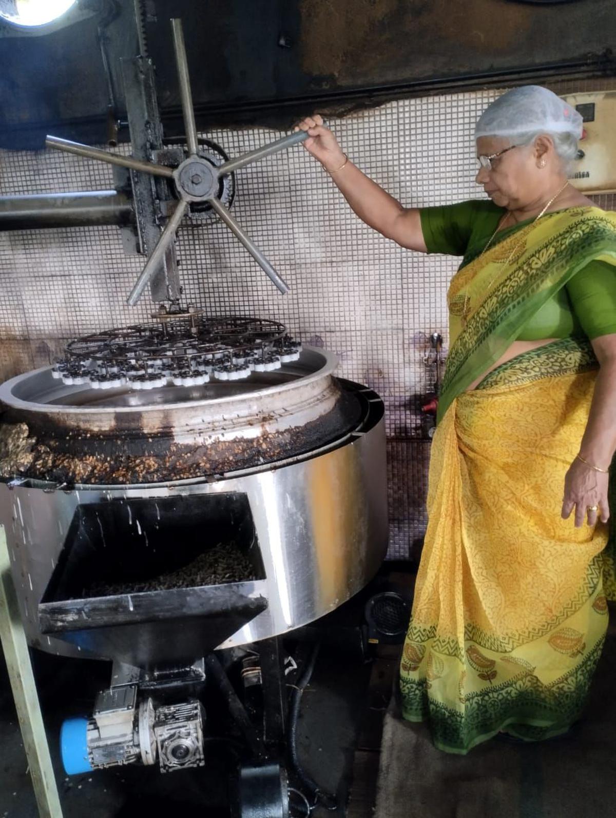 Kathrina Joseph supervises the making of achappam. 