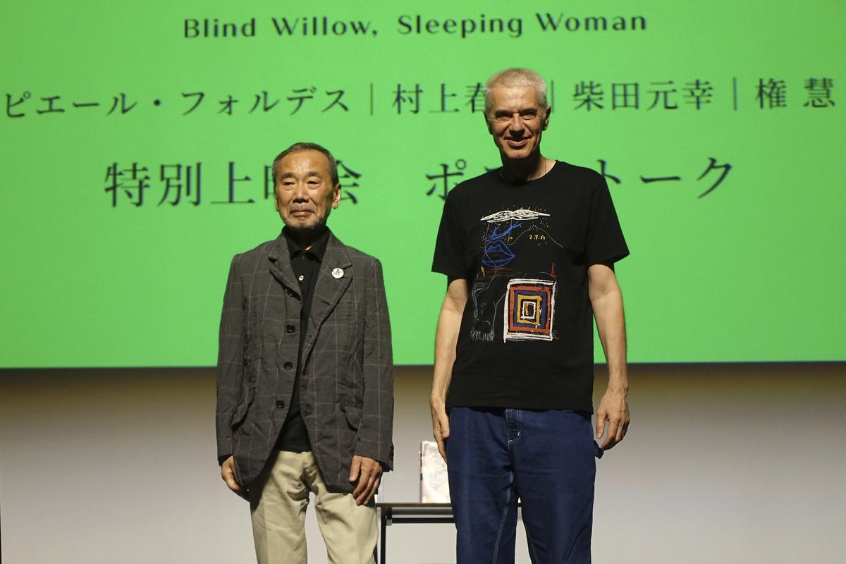 Novelist Haruki Murakami and film director Pierre Foldes pose for a photo at the end of a talk session after a screening of “Blind Willow, Sleeping Woman,” an animated film adapted from the Japanese author’s short stories, in Tokyo, June 15, 2024.