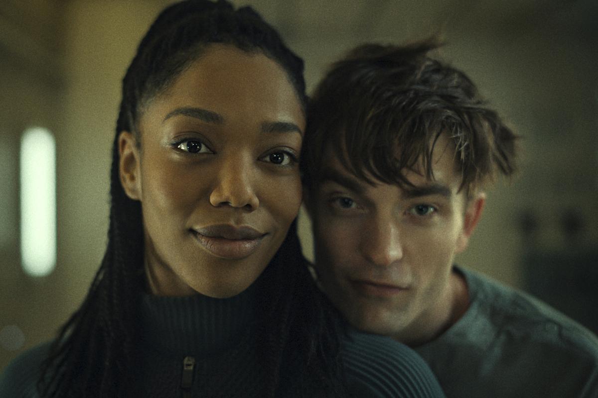 This image released by Warner Bros. Pictures shows Naomi Ackie, left, and Robert Pattinson in a scene from “Mickey 17.”