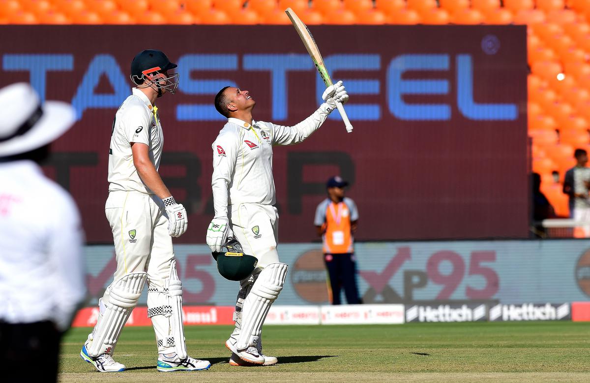 Khawaja savours the moment on reaching his century.