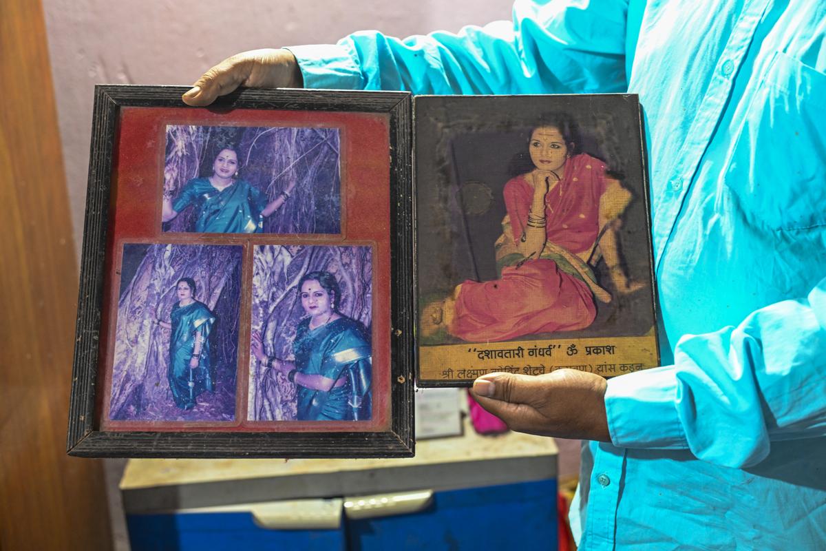 Omprakash Chavan displays the images of the women characters he has played at his house in Malvan, Sindhudurg. 
